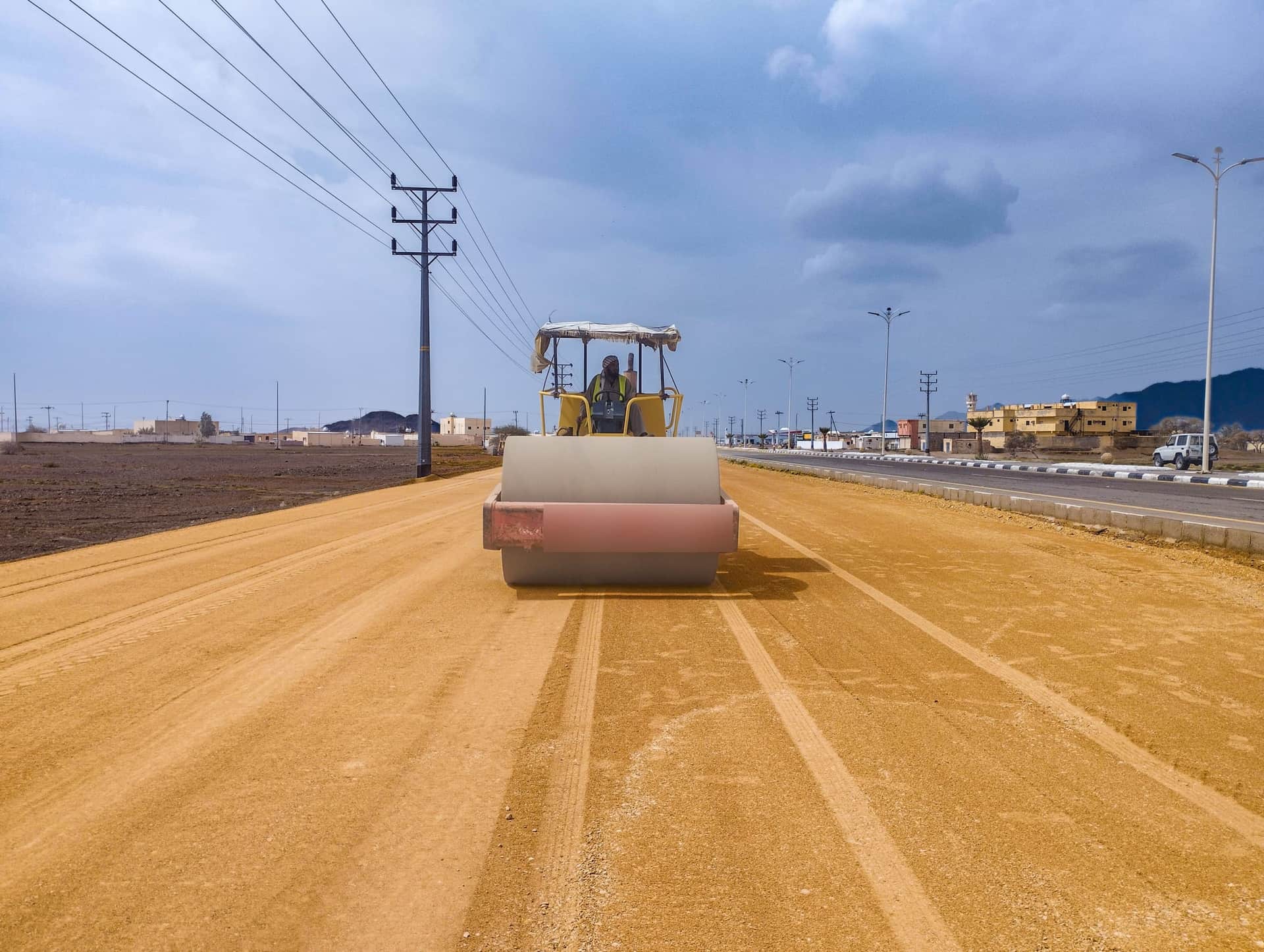 A road roller compacting a new highway in Saudi Arabia